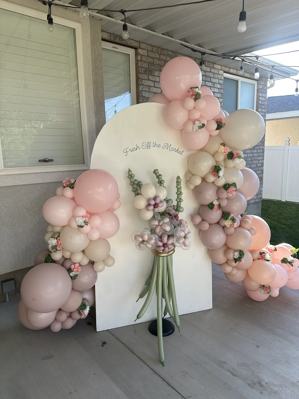 Floral balloon backdrop for a private celebration